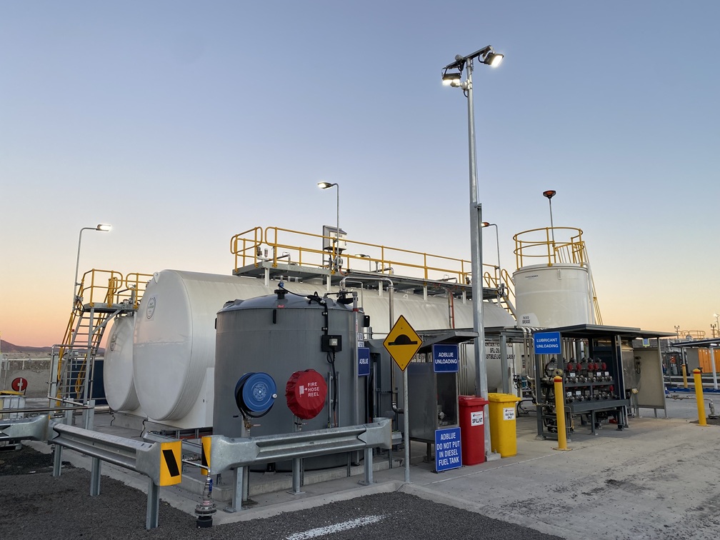 Fuel facility lighting and tanks at dusk